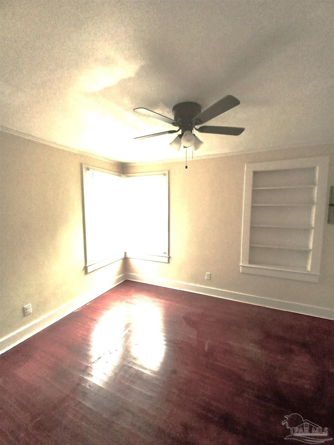1120 South Old Corry Field Road Pensacola, FL 32507 - Photo 7 of 10 a view of an empty room with a window
