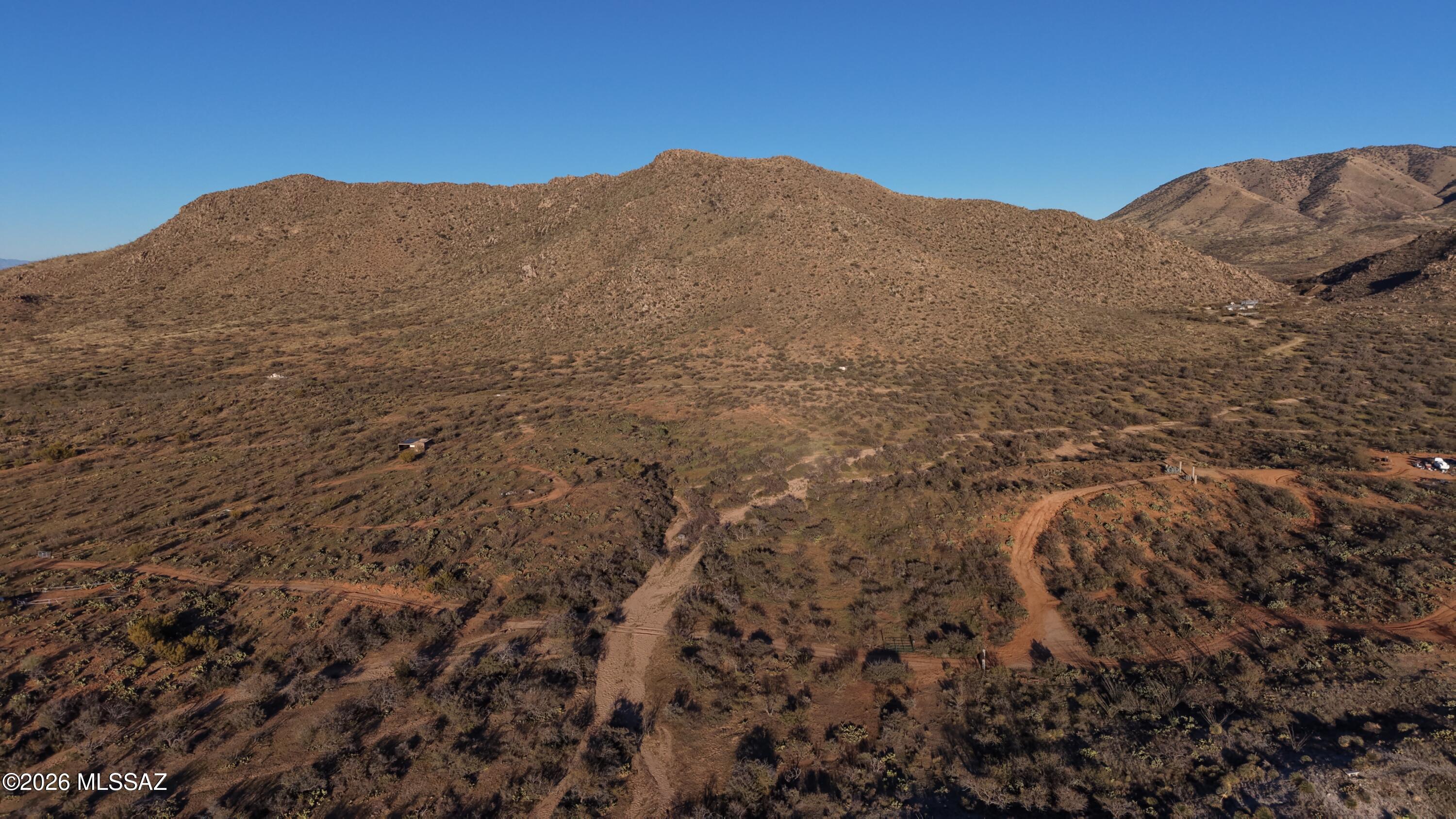 17027 South Sierrita Mountain Road Tucson, AZ 85736 - Photo 31 of 34 a view of a large mountain with a mountain in the background