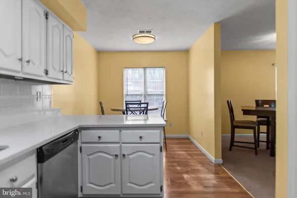 a view of a hallway with washer and dryer
