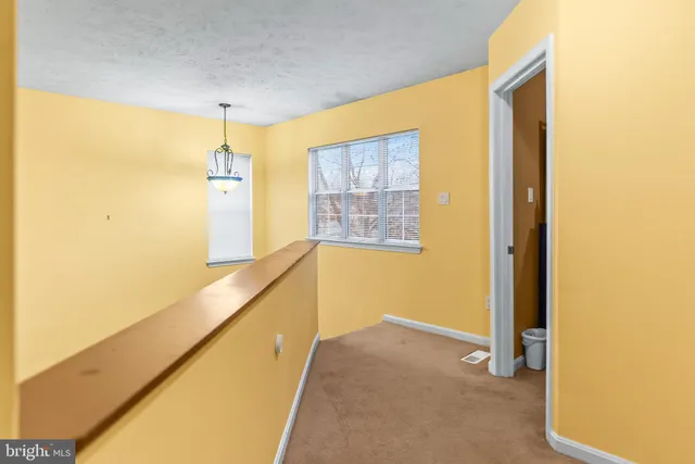 a view of hallway with a large window