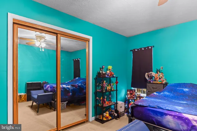 a room with furniture toys and a large window