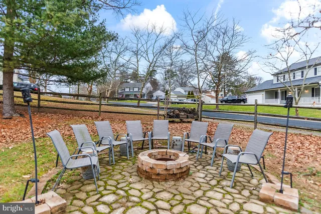 a view of a patio with iron fence