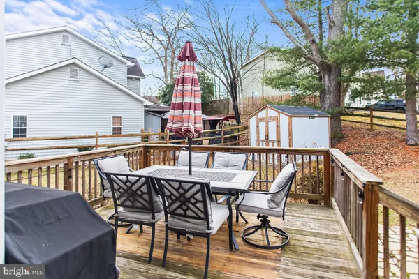 a view of a chairs and table on the deck