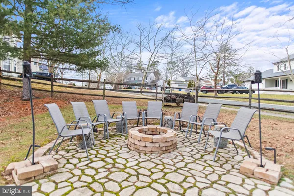 a view of a lake with outdoor seating