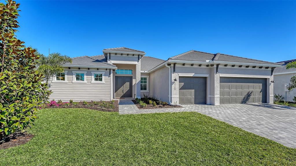 a front view of a house with a yard