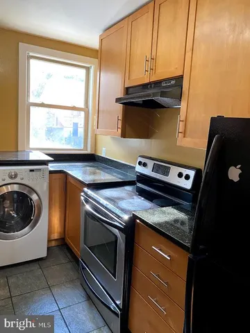 a kitchen with a stove and a microwave