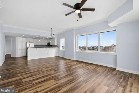 a view of a kitchen with a sink and cabinets