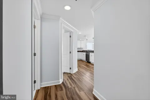 a bathroom with a double vanity sink toilet mirror and shower