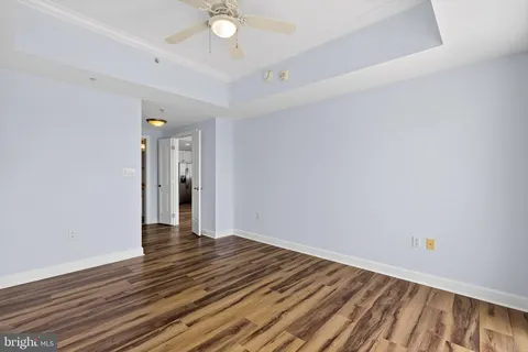 a view of an empty room and wooden floor