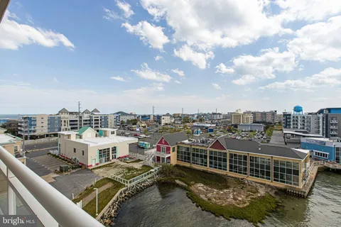 a view of multiple houses with a ocean view