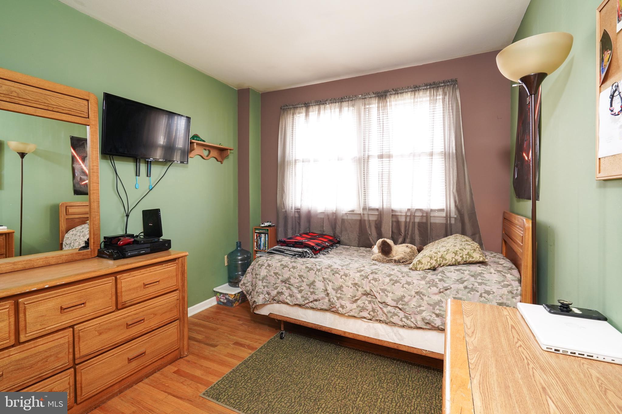 1136 Musket Road Newark, DE 19713 - Photo 12 of 16 a bedroom with a bed and a flat tv screen on dresser