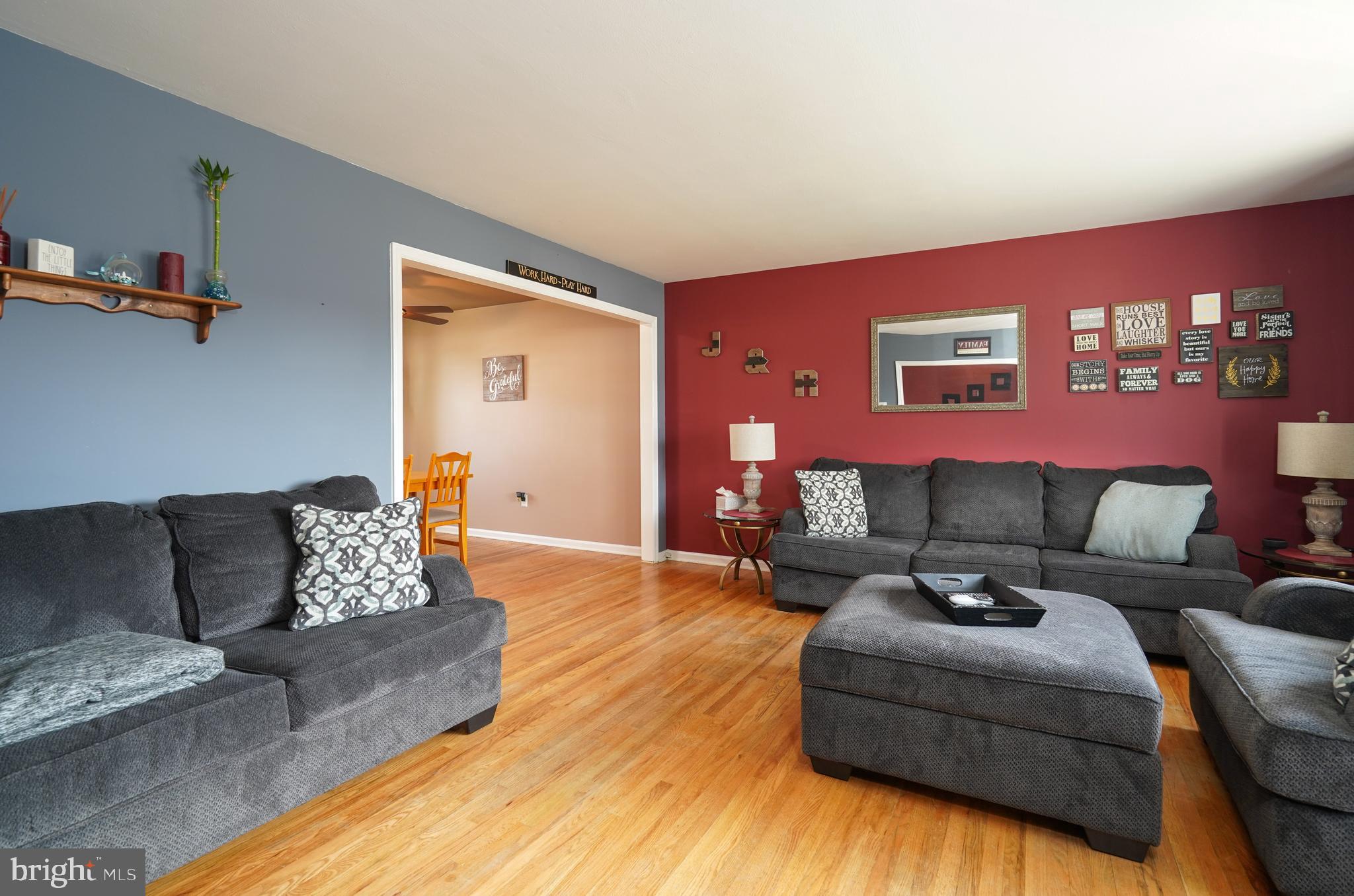1136 Musket Road Newark, DE 19713 - Photo 3 of 16 a living room with furniture and painting on the wall