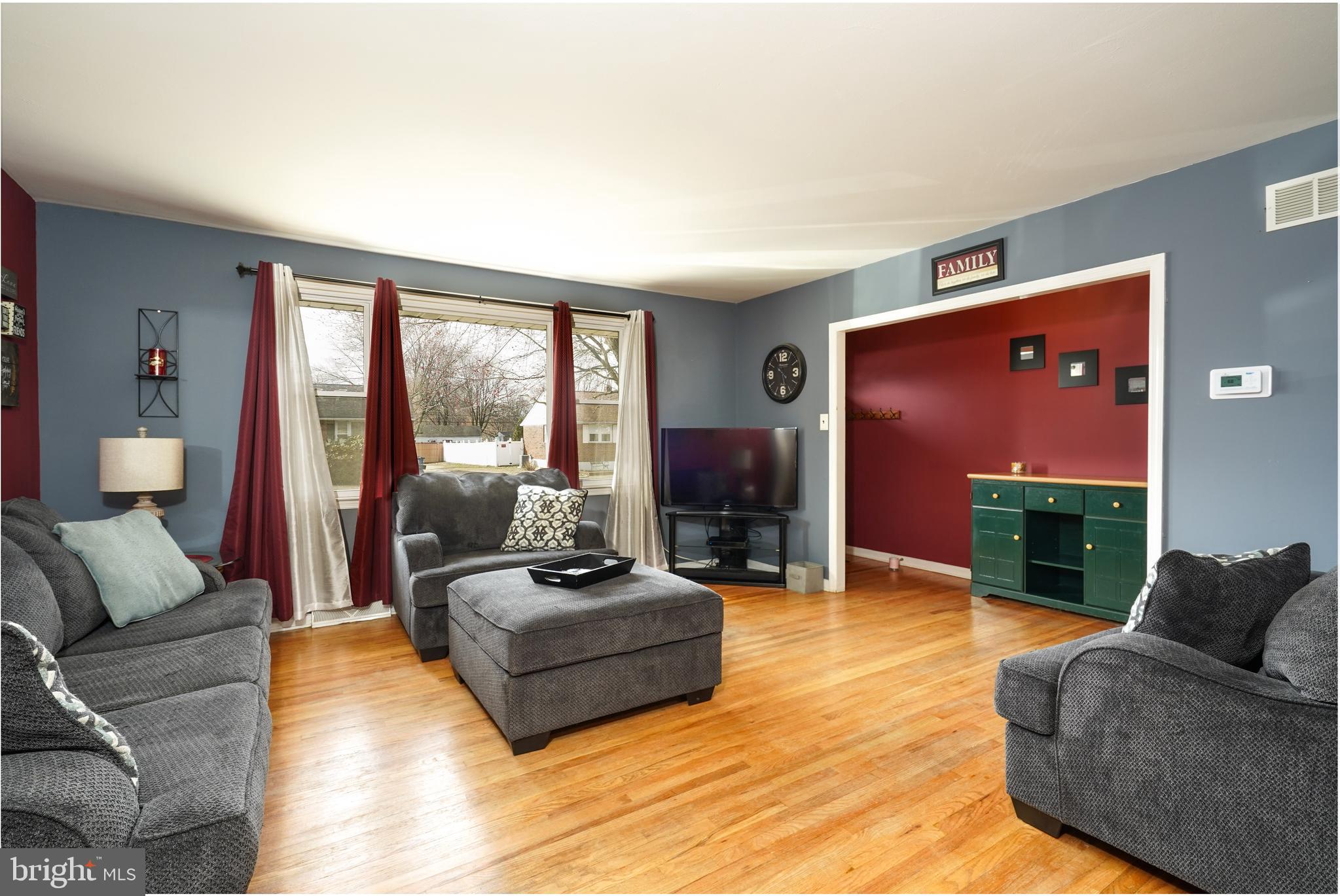 1136 Musket Road Newark, DE 19713 - Photo 5 of 16 a living room with furniture flat screen tv and a large window