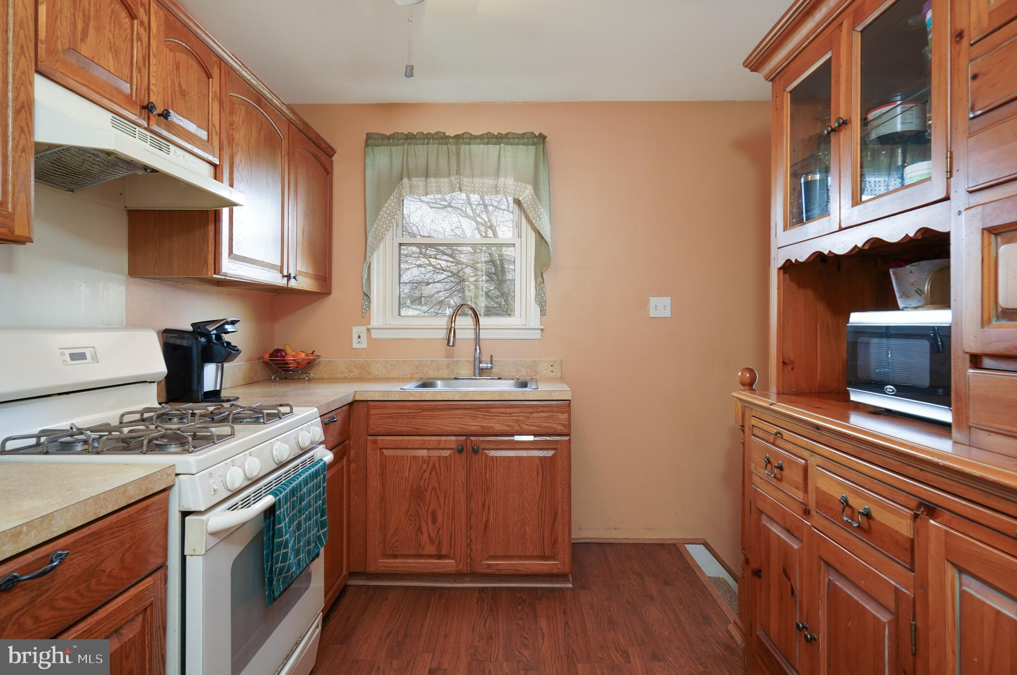 1136 Musket Road Newark, DE 19713 - Photo 7 of 16 a kitchen with stainless steel appliances granite countertop a stove and a sink