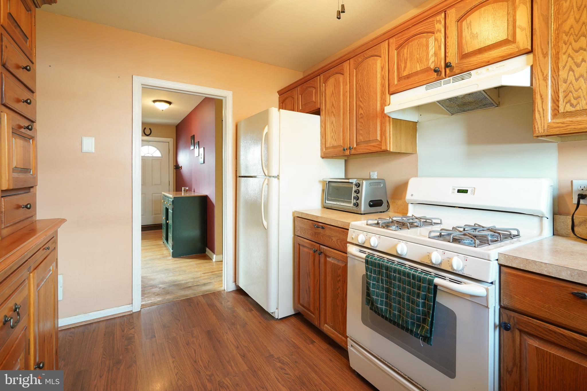 1136 Musket Road Newark, DE 19713 - Photo 8 of 16 a kitchen with a stove top oven and refrigerator