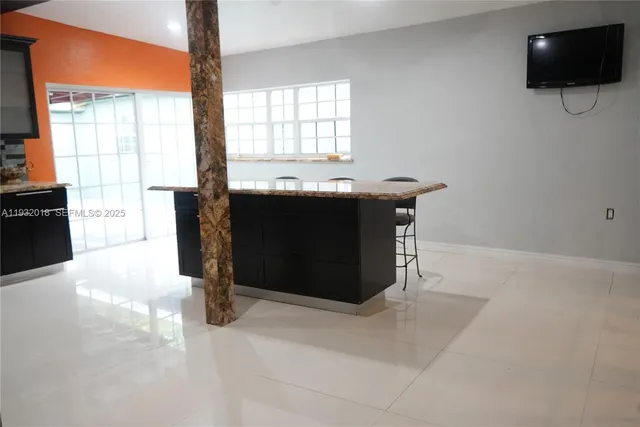 a view of living room with furniture and flat screen tv