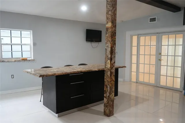 a view of cabinets with wooden floor
