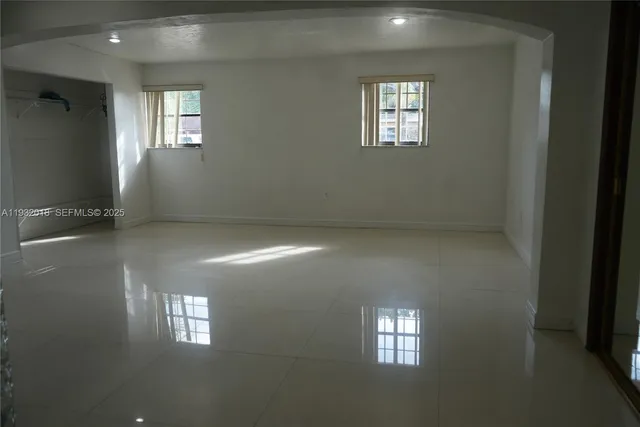 an empty room with windows