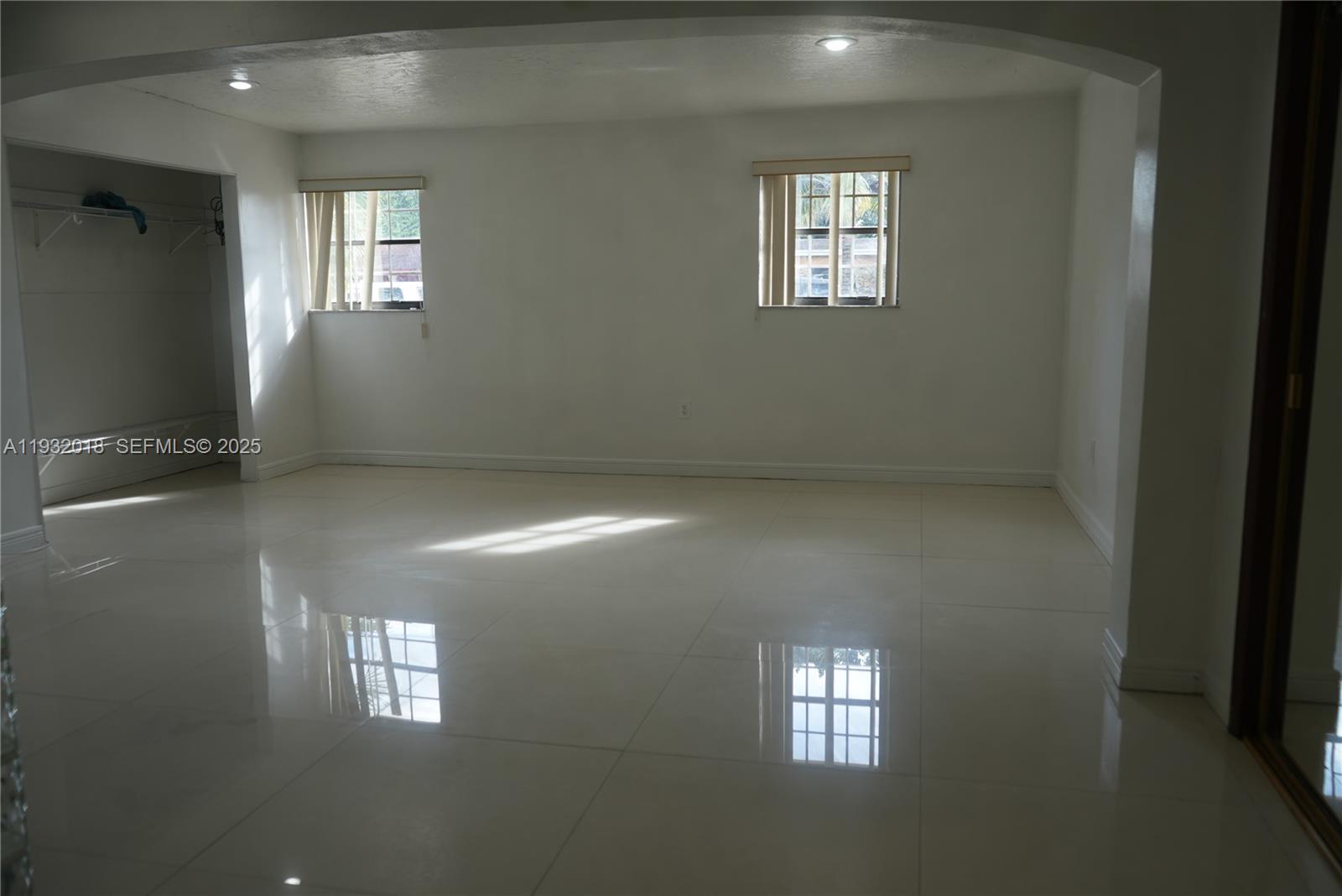 3285 Northwest 97th Street Miami, FL 33147 - Photo 14 of 44 an empty room with windows