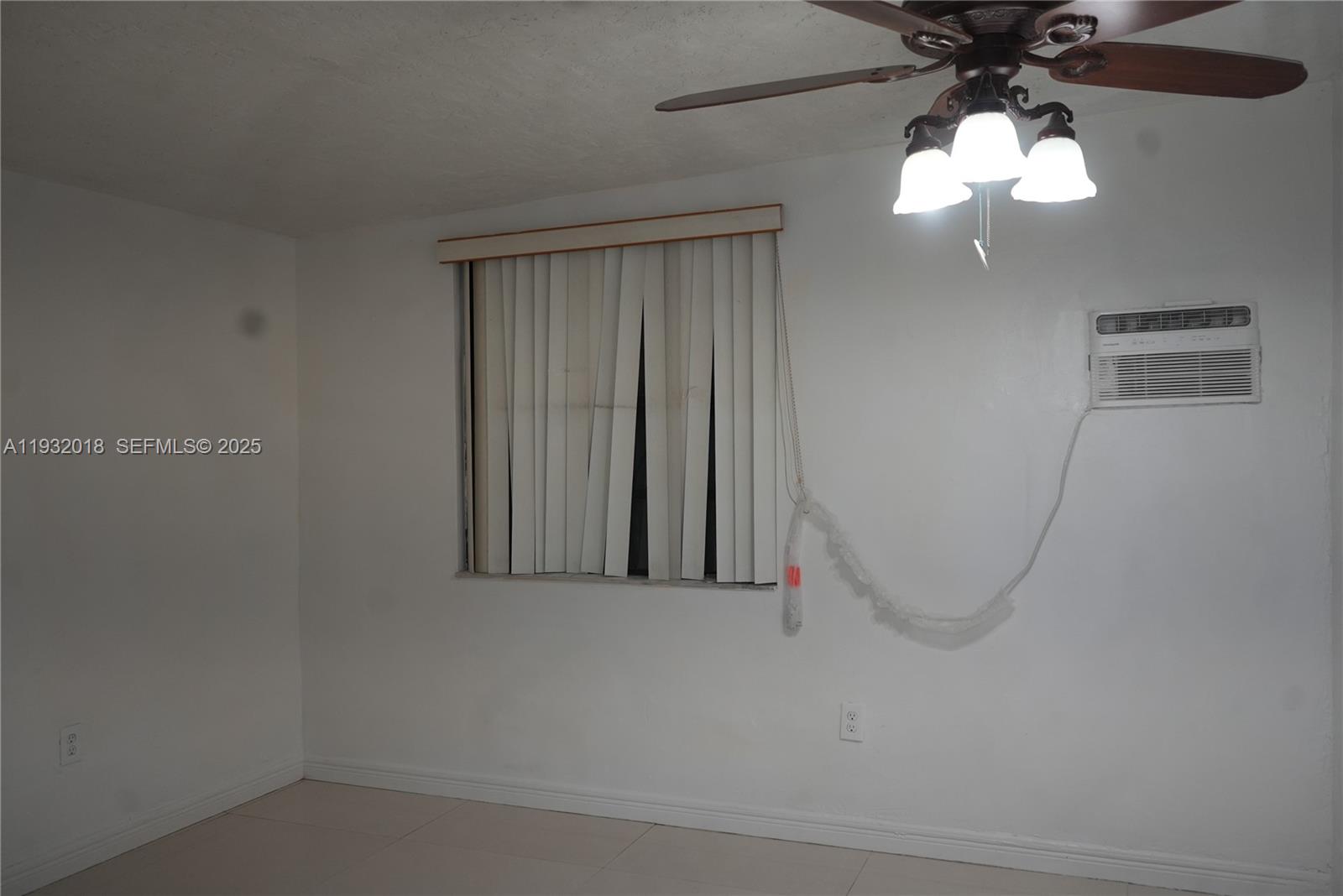 3285 Northwest 97th Street Miami, FL 33147 - Photo 22 of 44 a view of a livingroom with a window