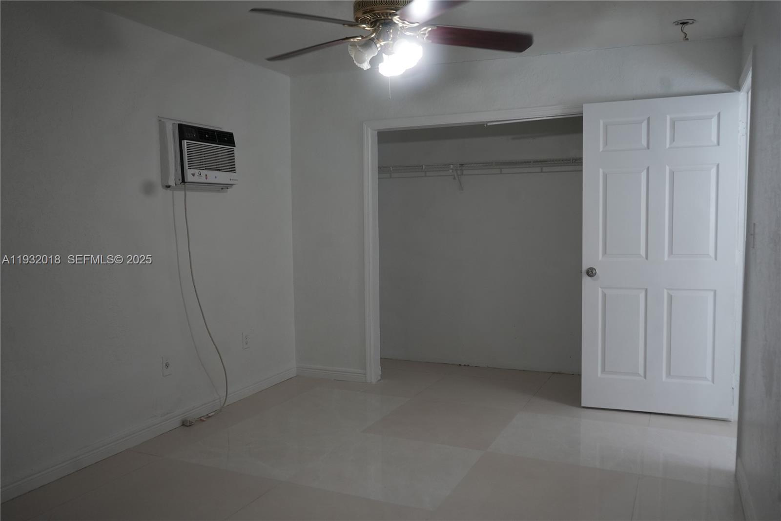 3285 Northwest 97th Street Miami, FL 33147 - Photo 26 of 44 an empty room with a ceiling fan