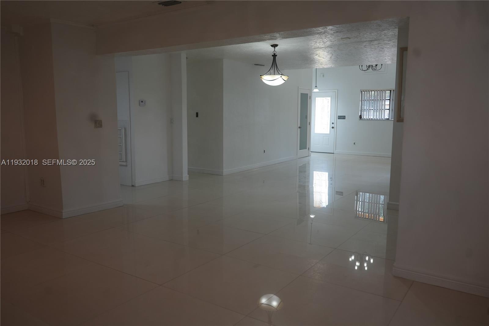 3285 Northwest 97th Street Miami, FL 33147 - Photo 3 of 44 an empty room with an empty space