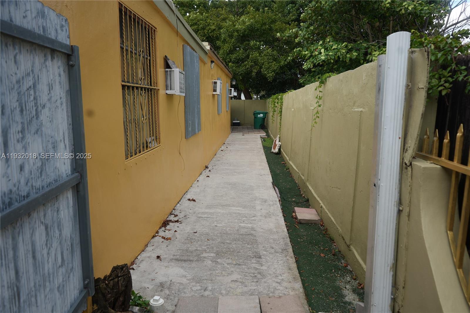 3285 Northwest 97th Street Miami, FL 33147 - Photo 36 of 44 a view of a pathway of a building