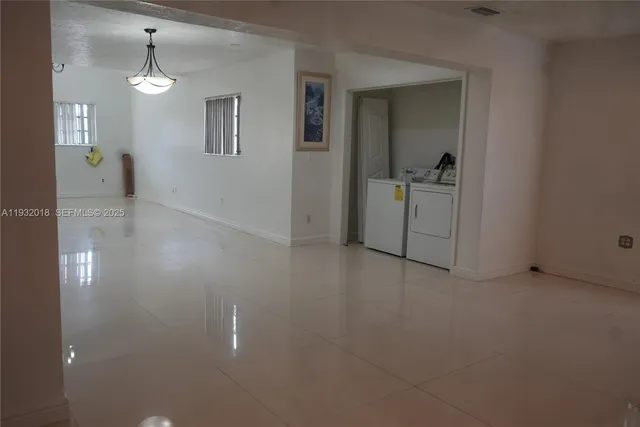 a view of a hallway with closet