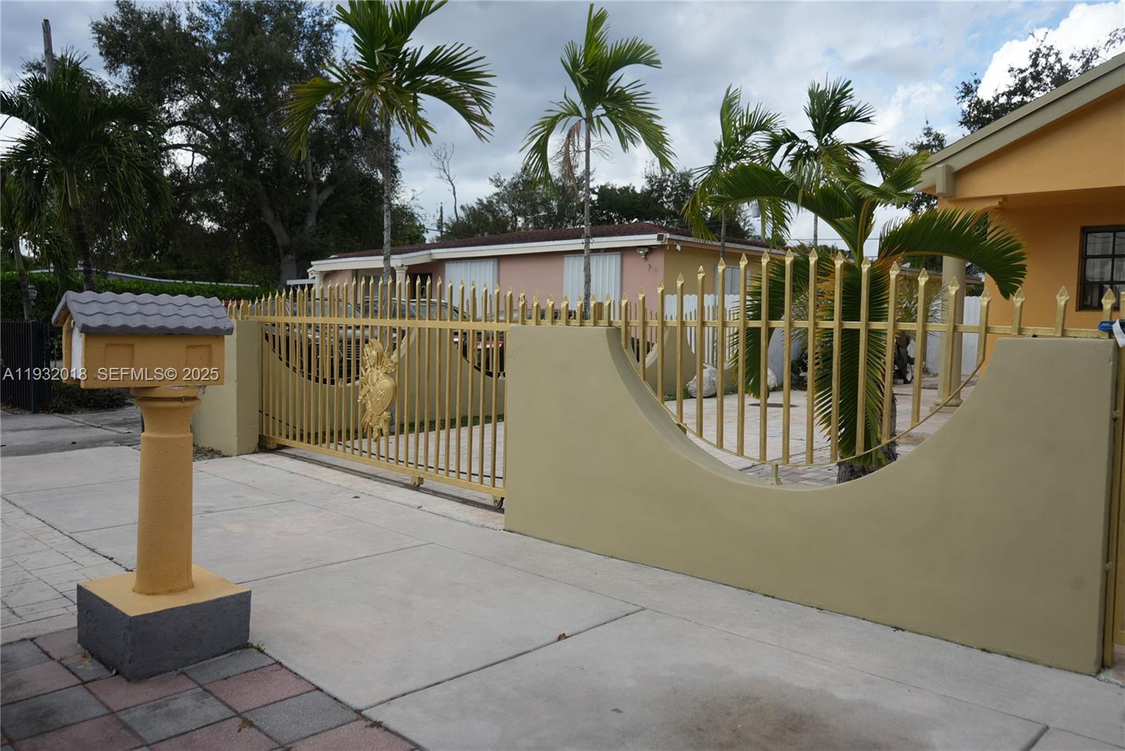 3285 Northwest 97th Street Miami, FL 33147 - Photo 43 of 44 a view of swimming pool with a bench and palm trees