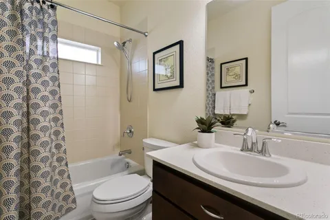 a kitchen with stainless steel appliances granite countertop a sink a refrigerator and a wooden cabinets