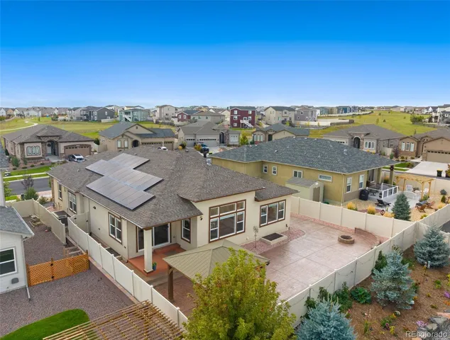 an aerial view of a house with a ocean view