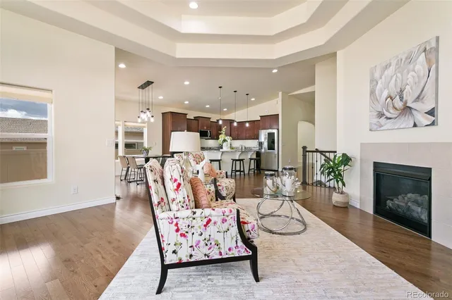 a kitchen with kitchen island granite countertop a sink stove and refrigerator