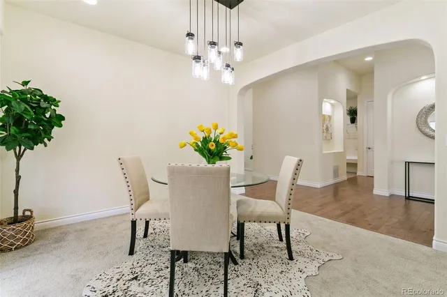 a spacious bedroom with a bed and a couch