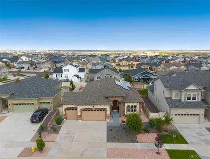 an aerial view of residential building with parking