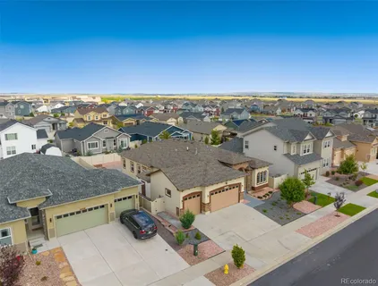 an aerial view of residential houses with city view