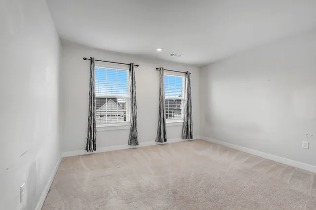 a bathroom with a sink toilet vanity and tub