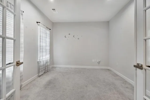 a view of livingroom with an empty room