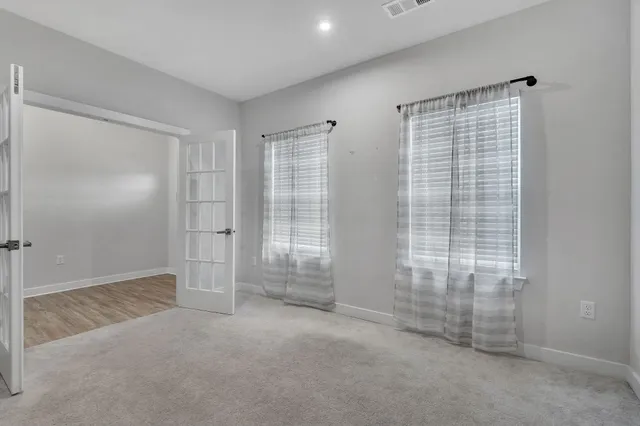 a view of a kitchen with a sink and a fireplace