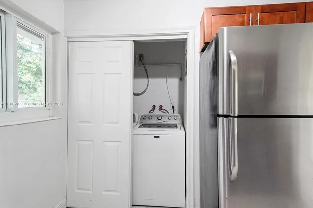 a white refrigerator freezer sitting in a kitchen