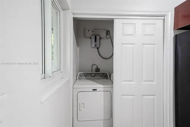 a utility room with a washer and dryer