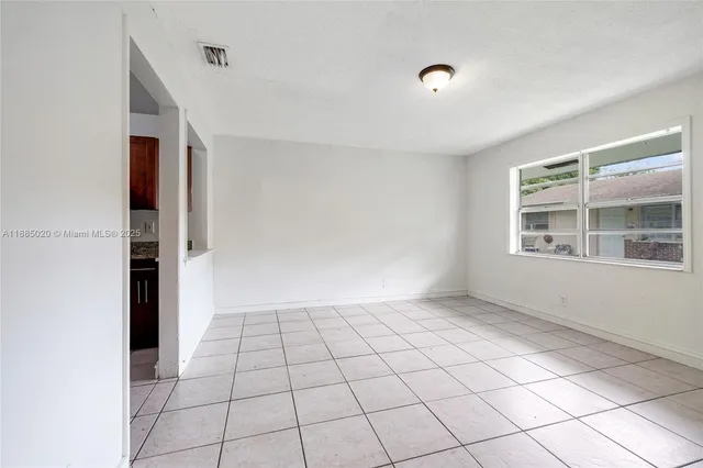a view of an empty room and window