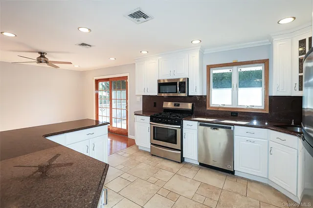 a view of room with wooden floor