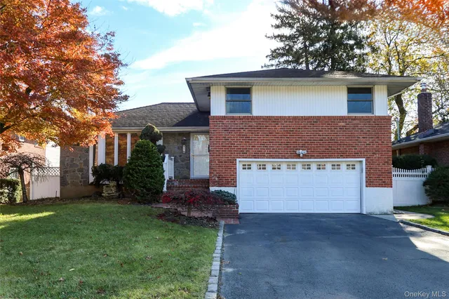 a bathroom with a sink mirror and toilet