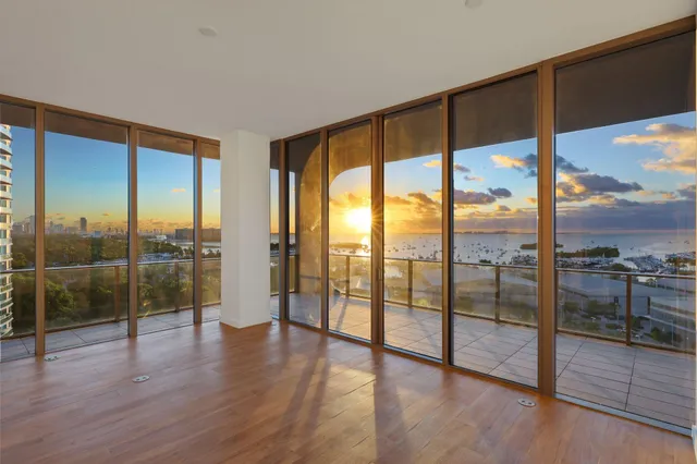 a kitchen with a large window and sink
