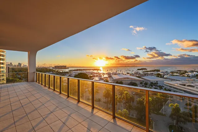 a kitchen with stainless steel appliances a sink a stove and a wooden floors