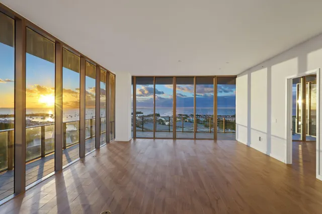 a kitchen with stainless steel appliances granite countertop a sink and a refrigerator