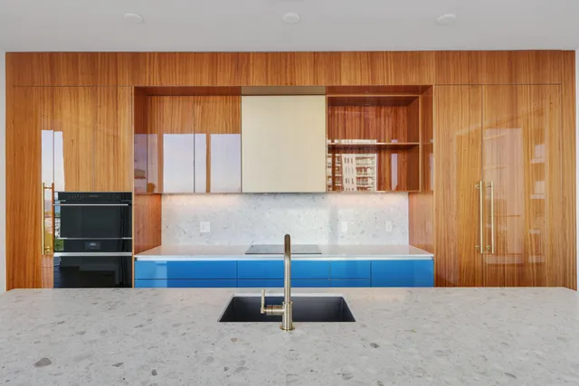 a view of a hallway with toilet and a window