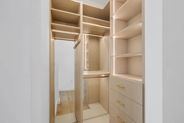 a view of an entryway with wooden floor