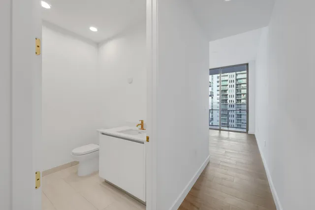 a living room with furniture a potted plant and a potted plant