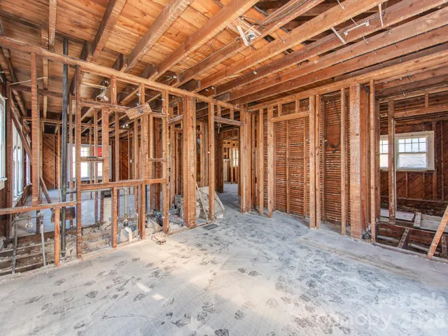 a view of an empty room with wooden walls